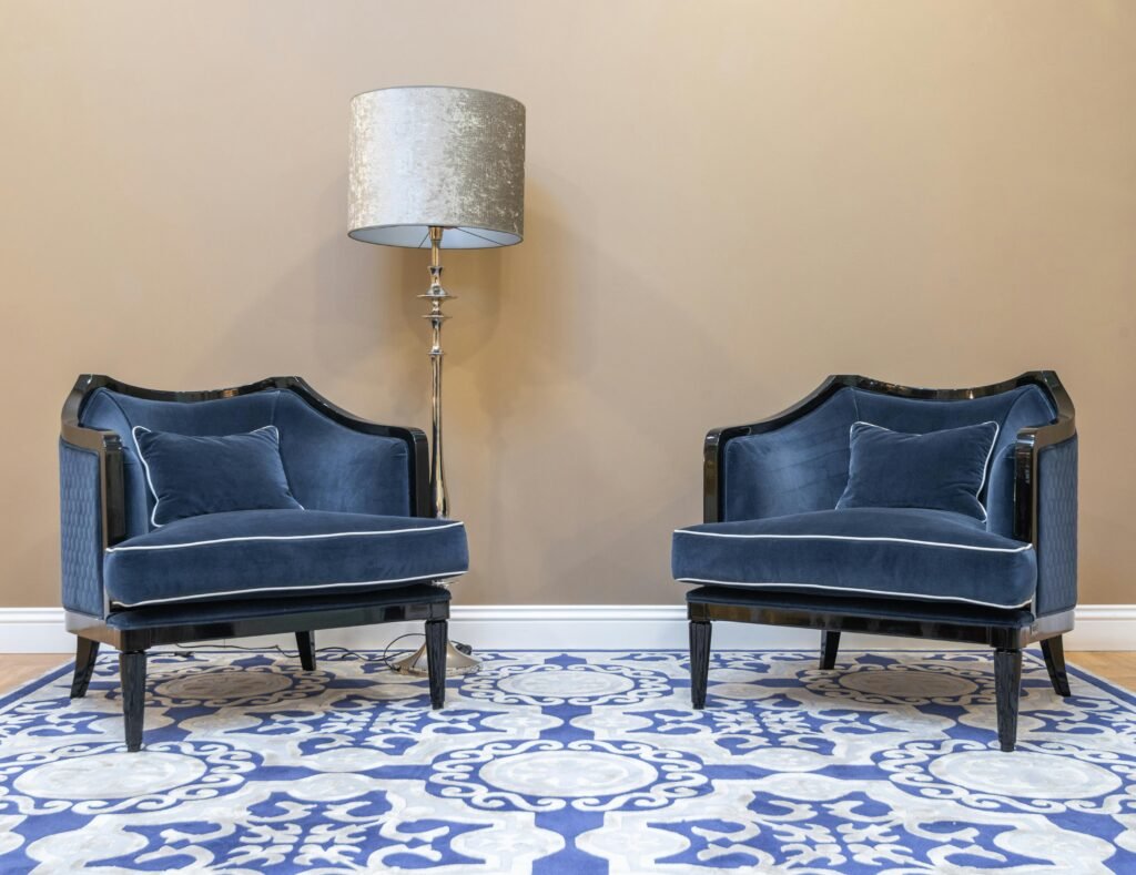 Bright minimalist interior with white wall paneling, window light, and hanging plants